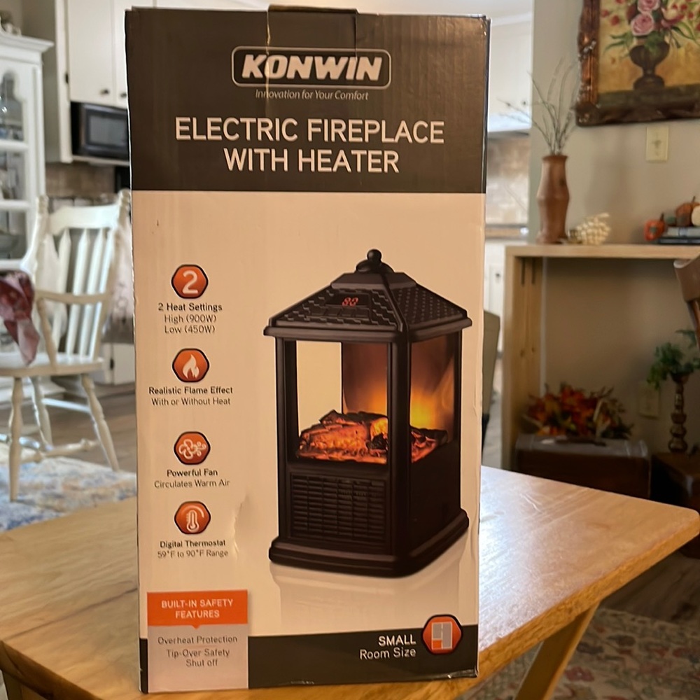 Konwin electric fireplace/heater. 2  Settings, Realistic Flame, fan, thermostat
